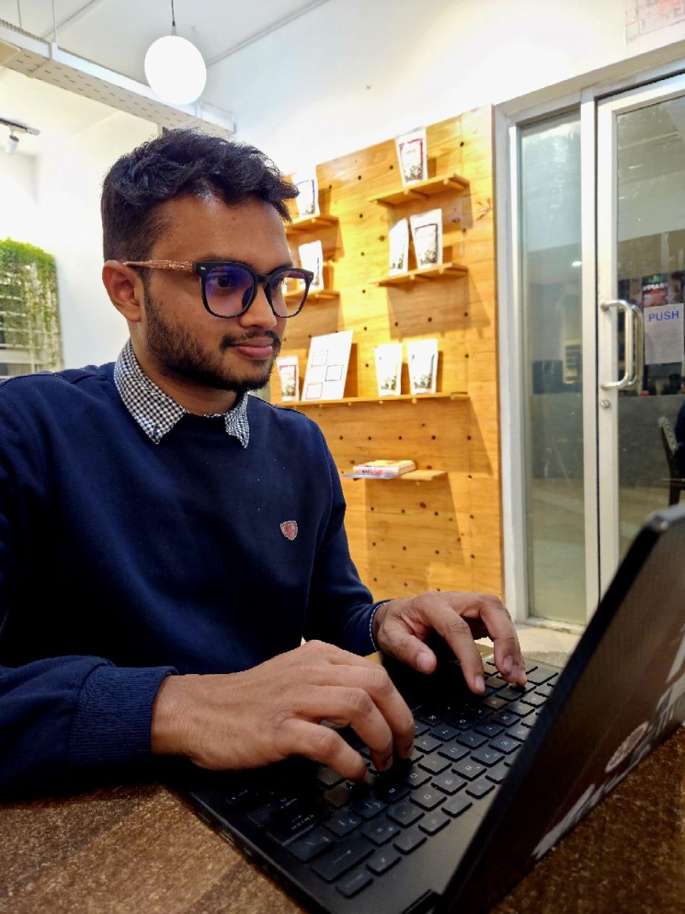 Souvik writing on his laptop